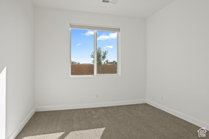 Unfurnished room with carpet floors