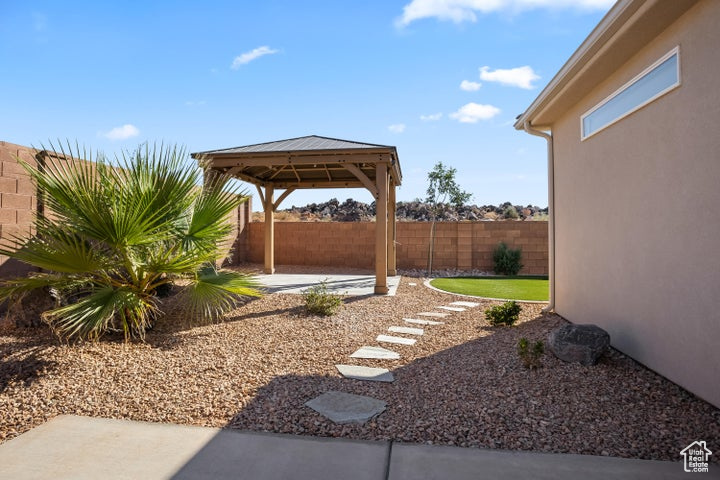 View of yard with a gazebo and a patio area