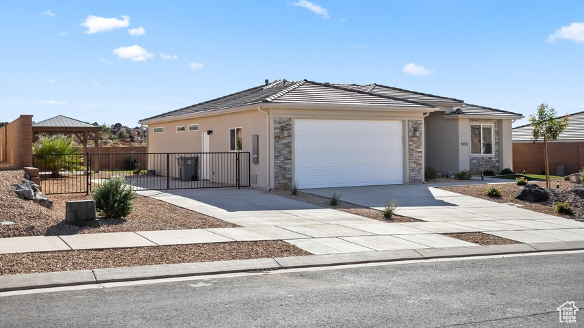 View of front facade featuring a garage