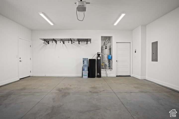 Garage with a garage door opener and electric panel