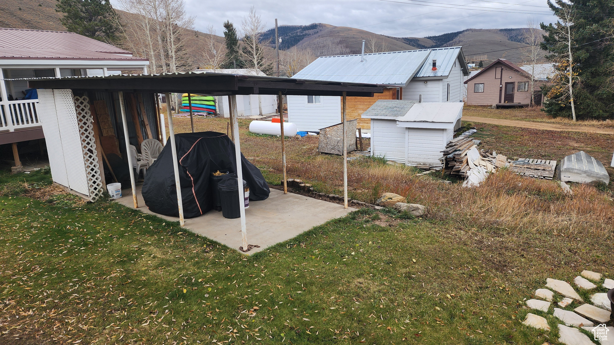 Exterior space featuring a storage shed and a mountain view