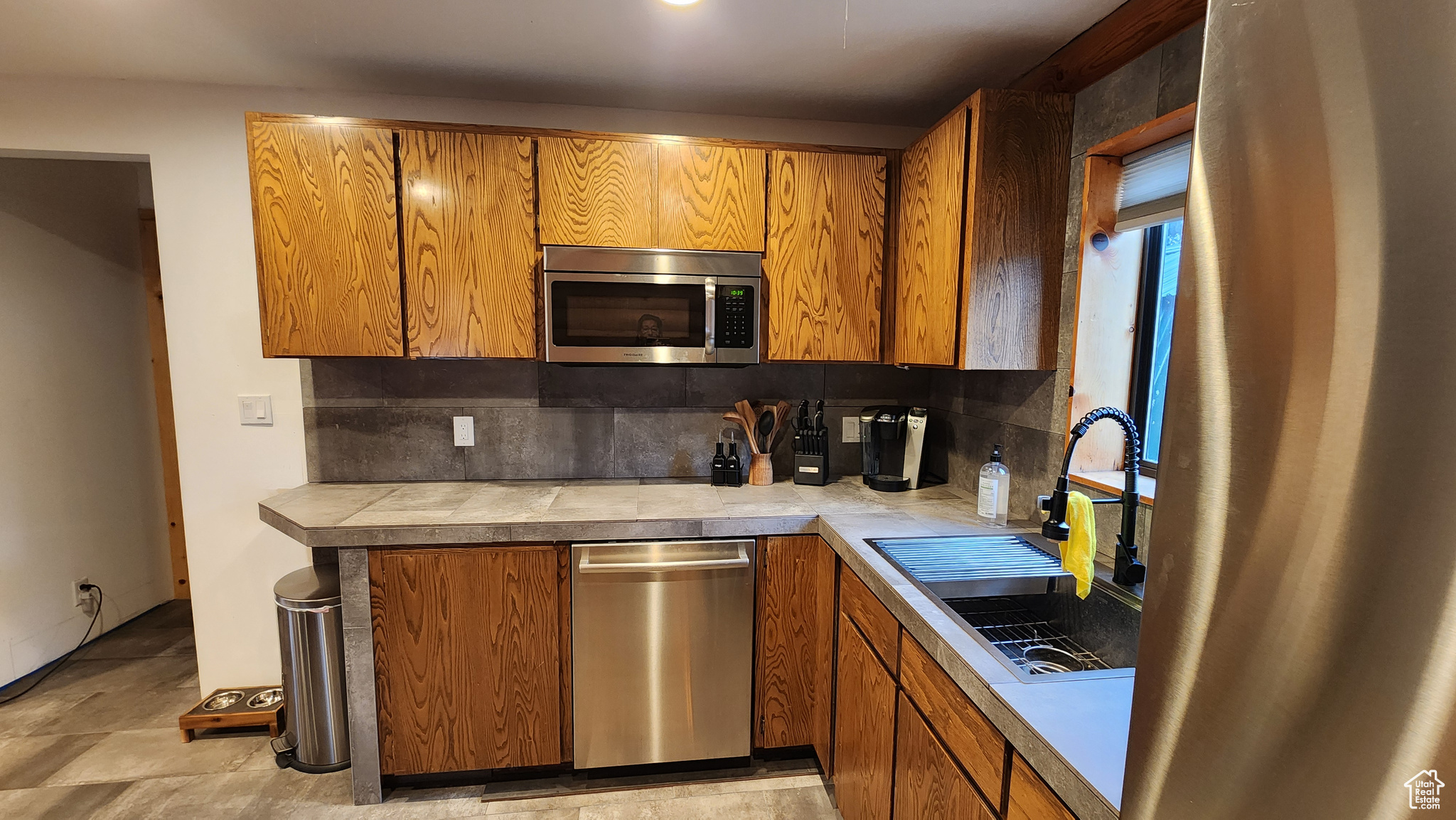 Kitchen with decorative backsplash and sink