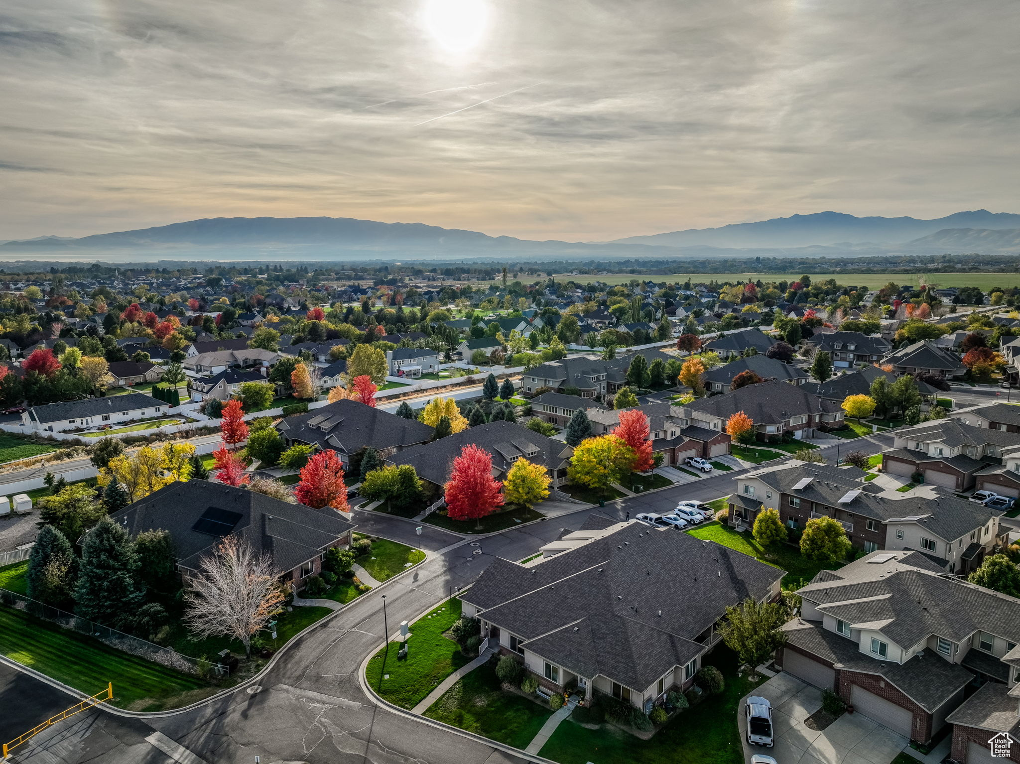 Aerial view at dusk featuring a mountain view