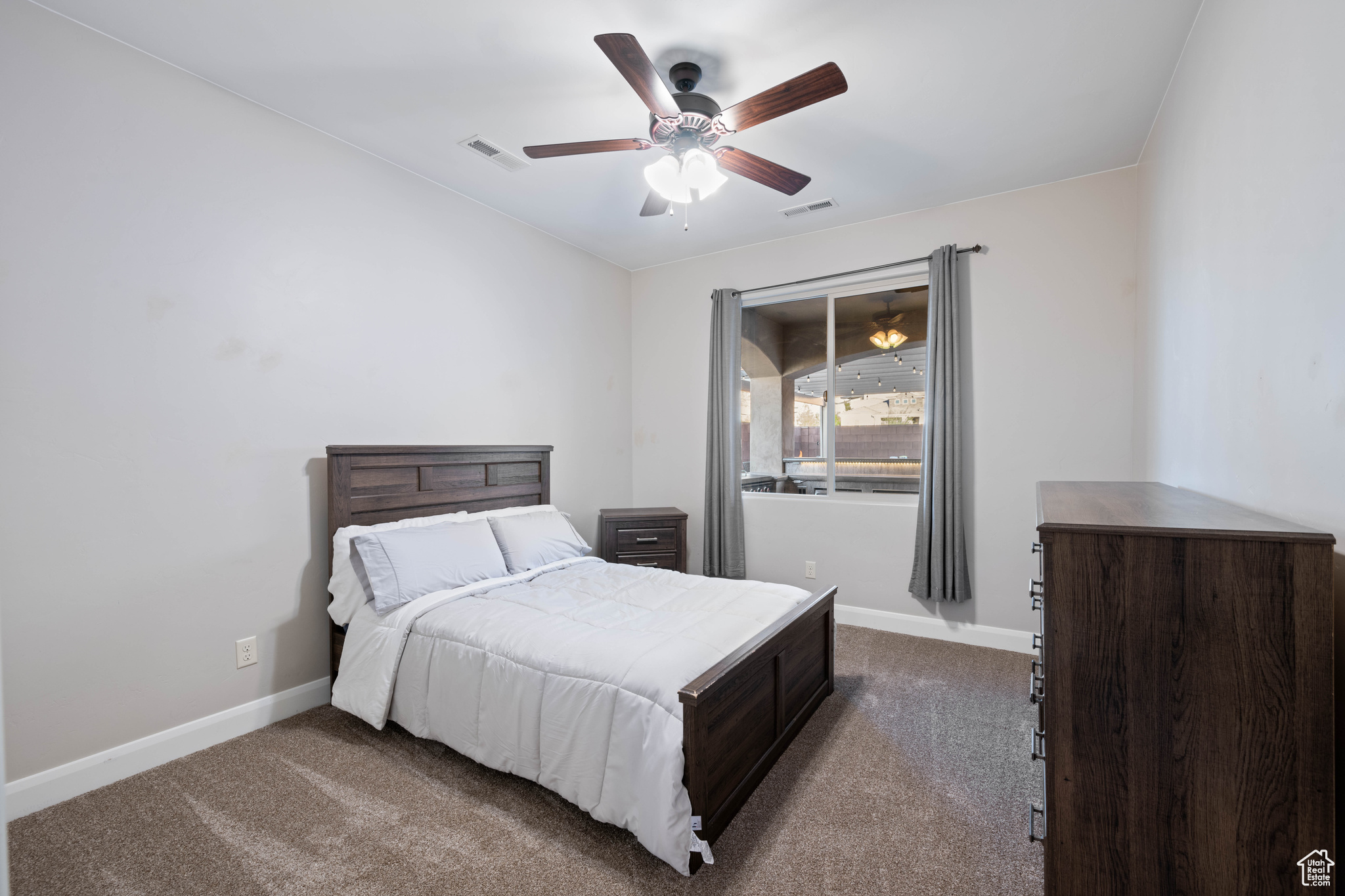 Bedroom with carpet flooring and ceiling fan