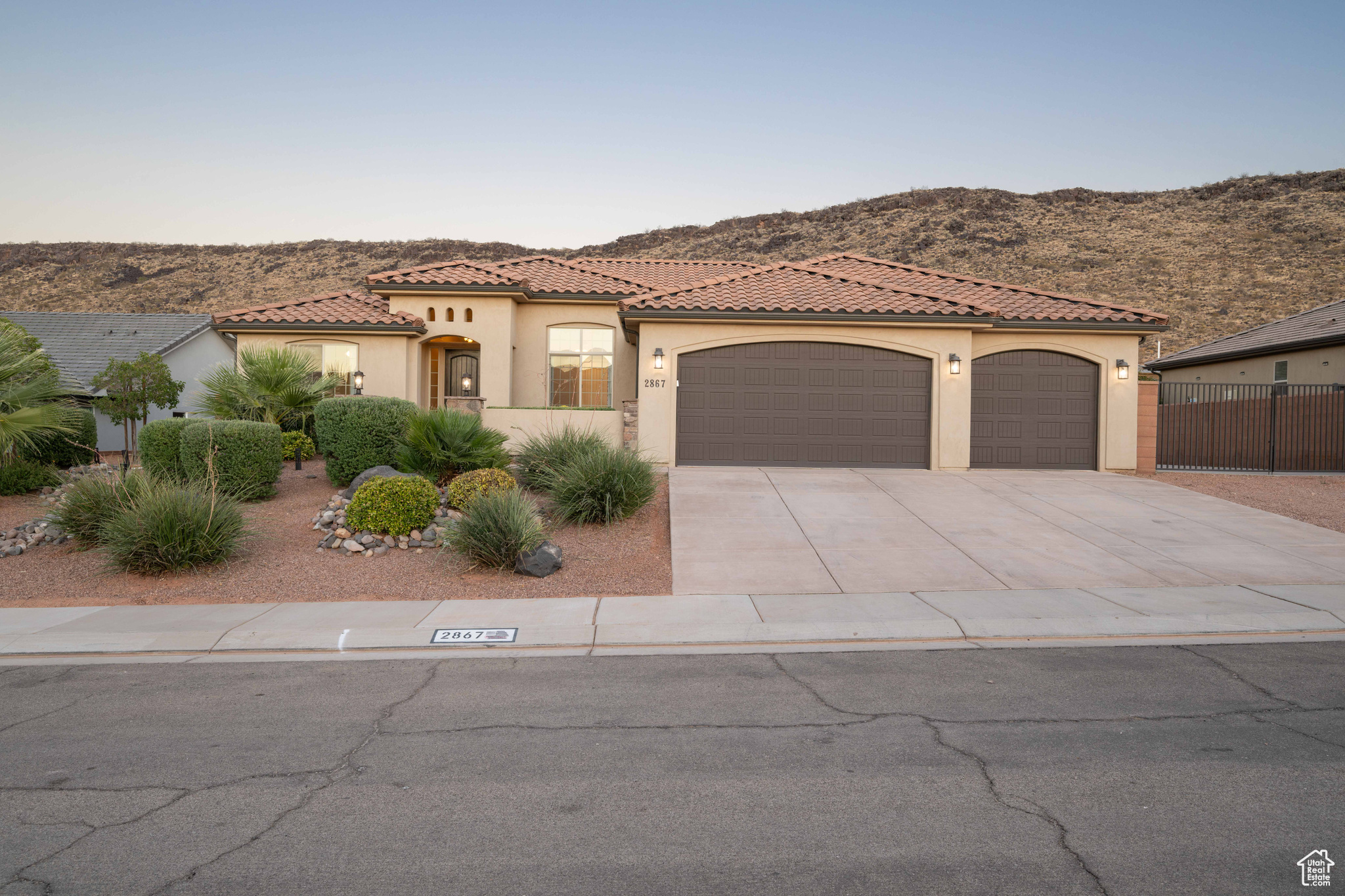 Mediterranean / spanish-style house featuring a mountain view and a garage