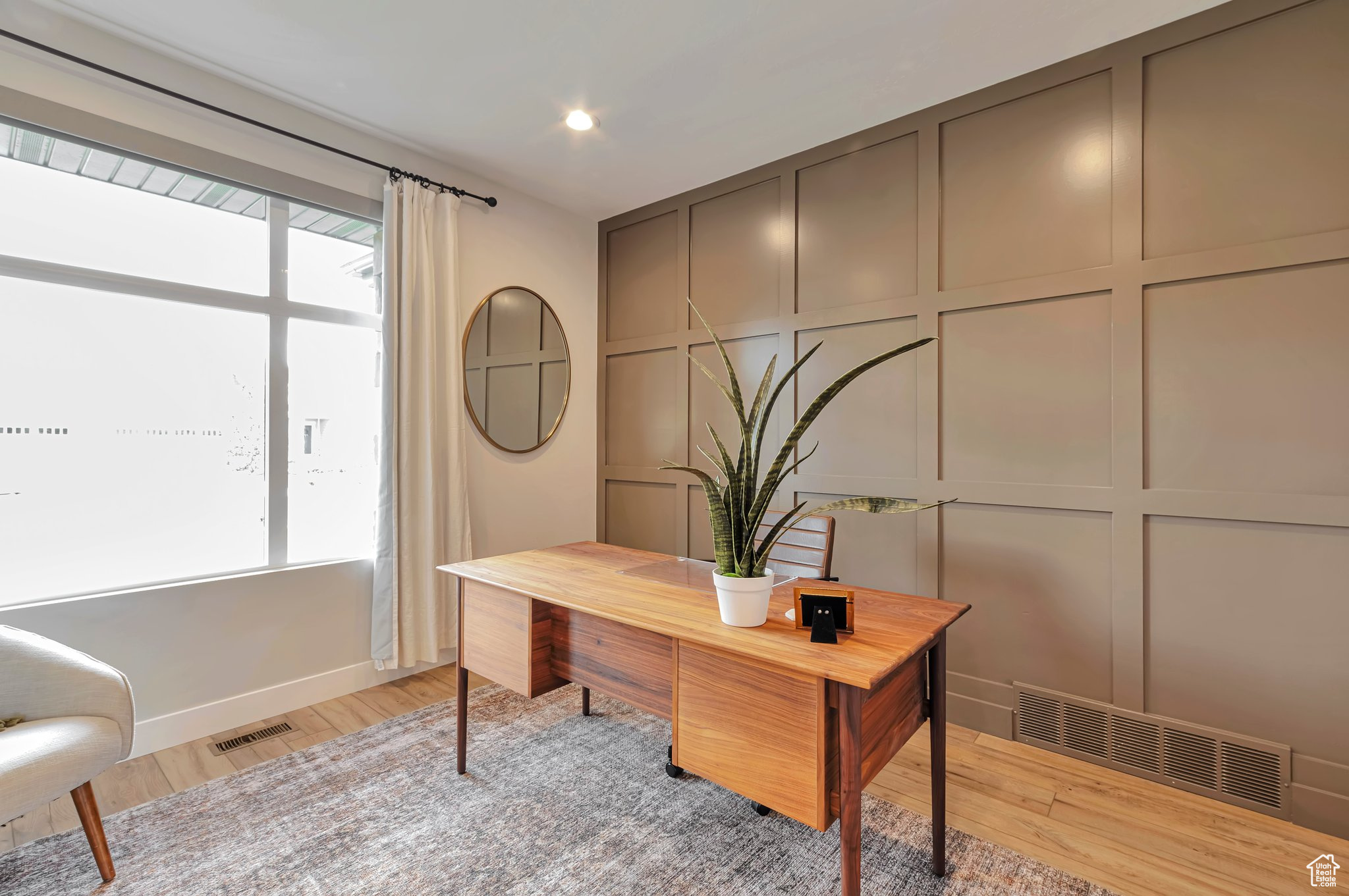 Office space featuring light hardwood / wood-style floors