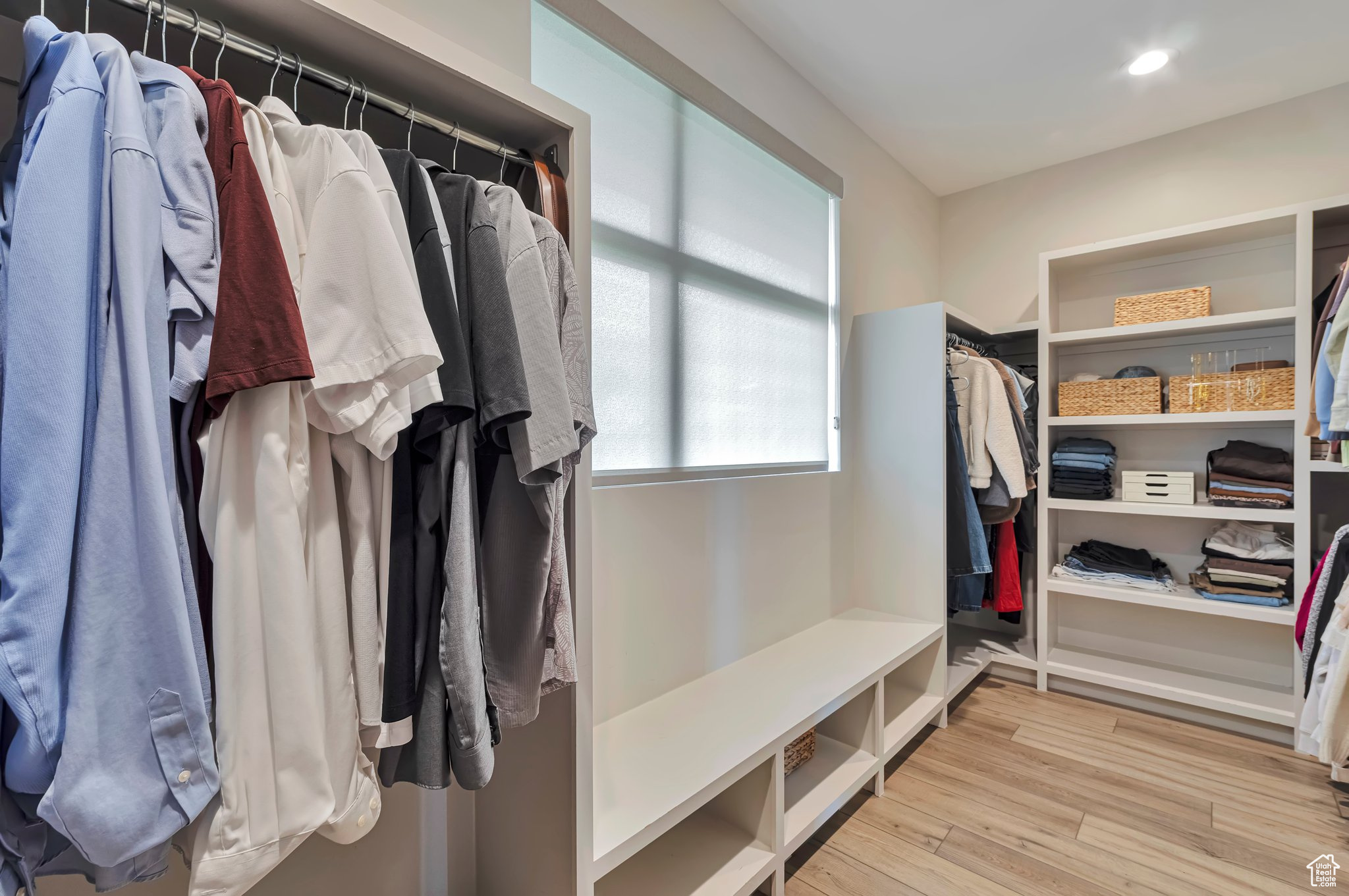 Walk in closet featuring light hardwood / wood-style flooring