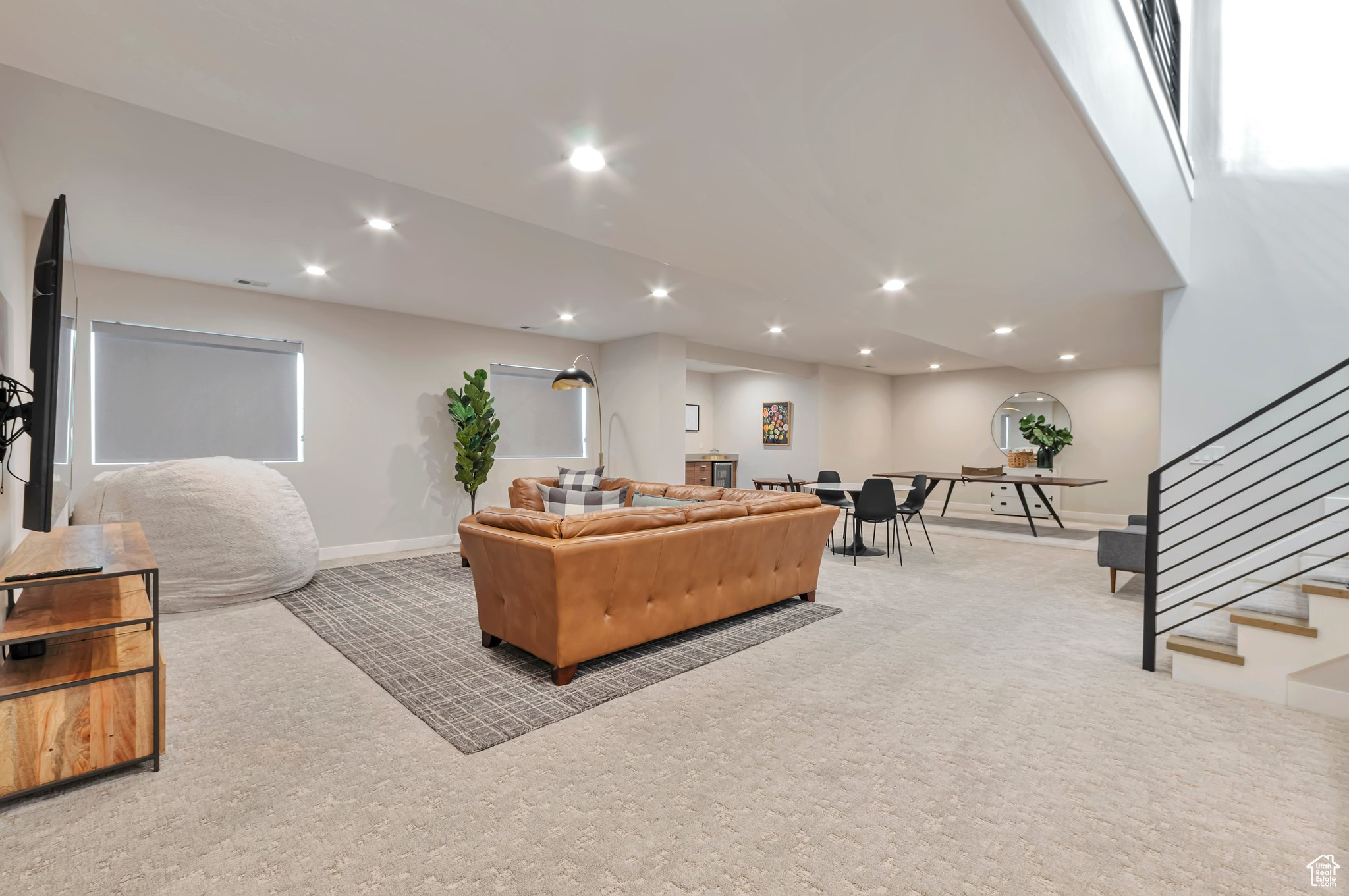 Living room featuring light carpet