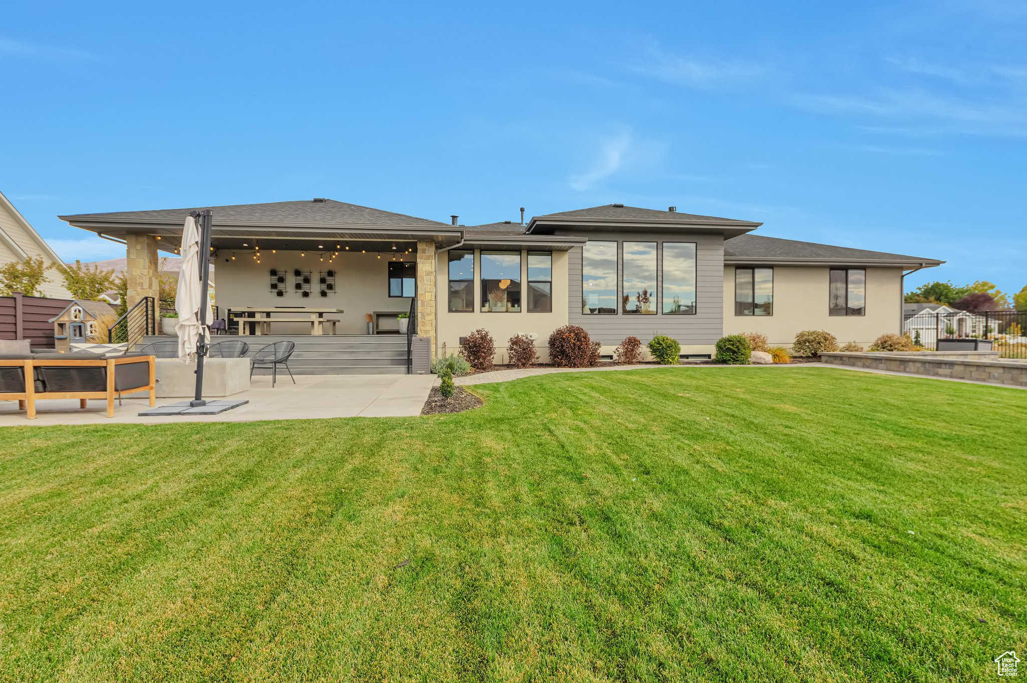 Back of property featuring a patio and a yard