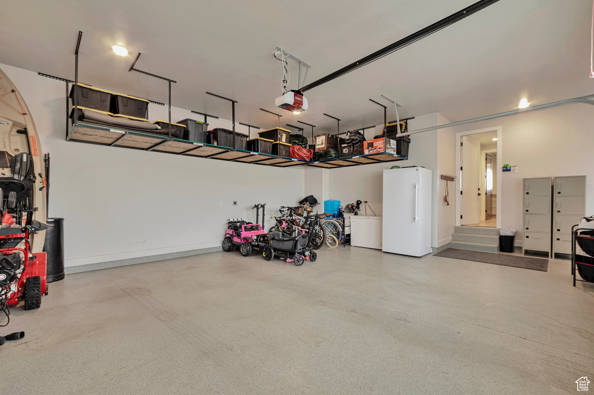 Garage with a garage with epoxy flooring