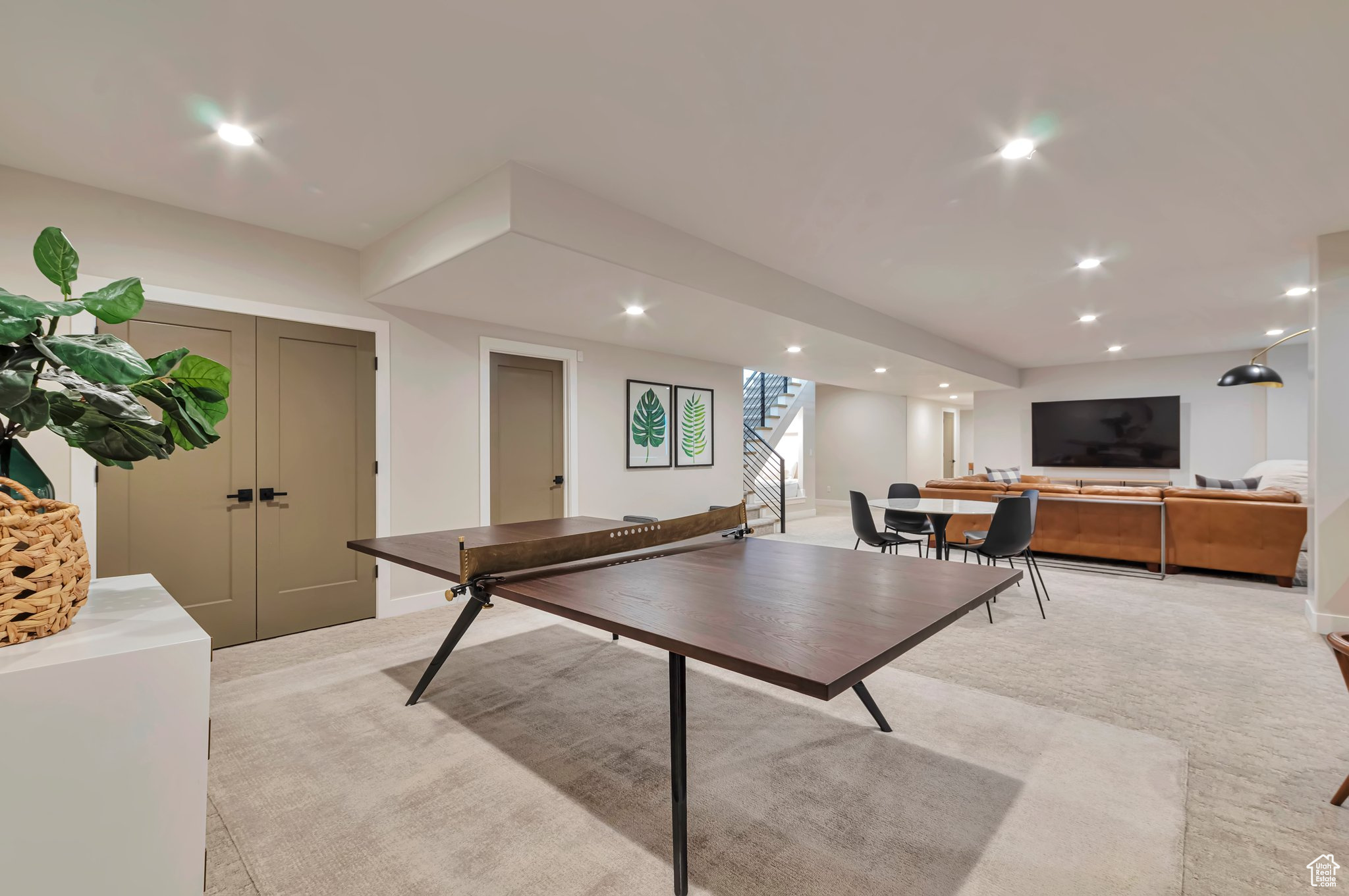 Game room with light colored carpet