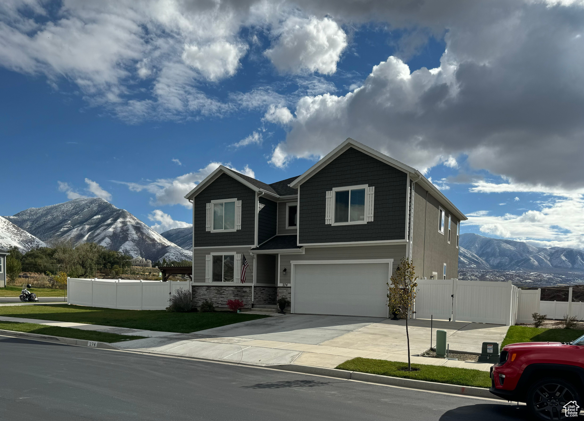 View of front of home featuring a mountain view and a garage