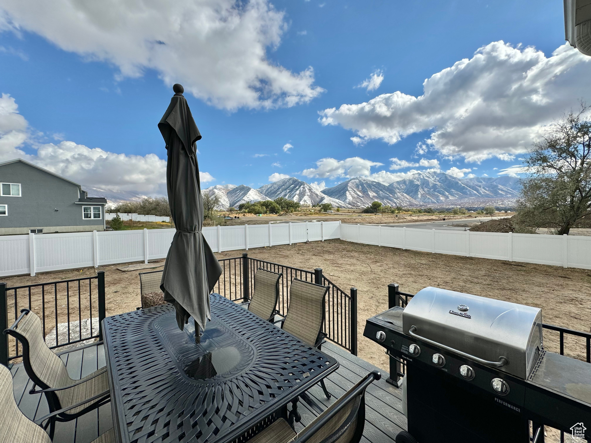 Patio off Kitchen. Wooden terrace featuring a mountain view and grilling area