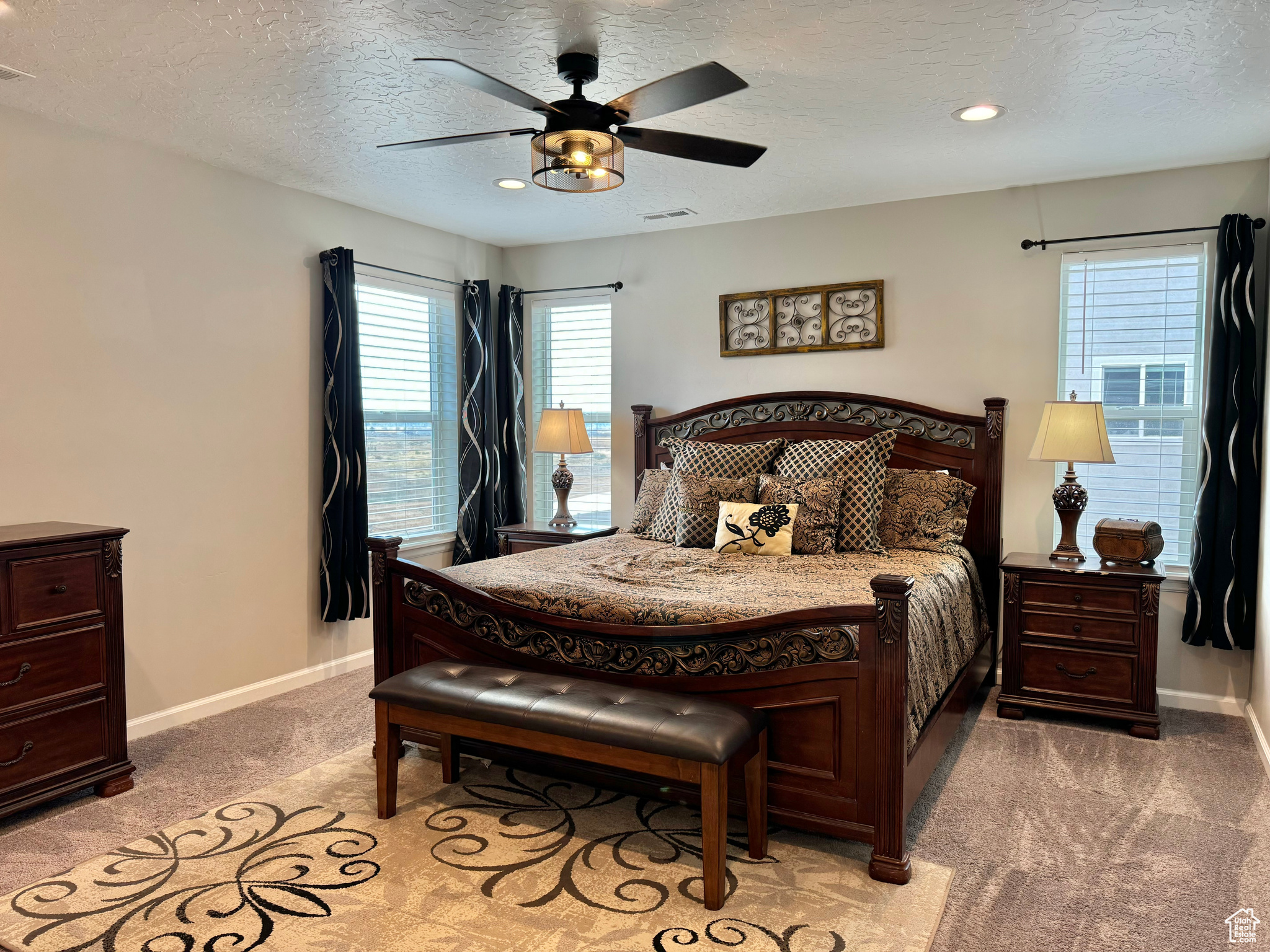 Upstairs Master Bedroom featuring a textured ceiling and ceiling fan