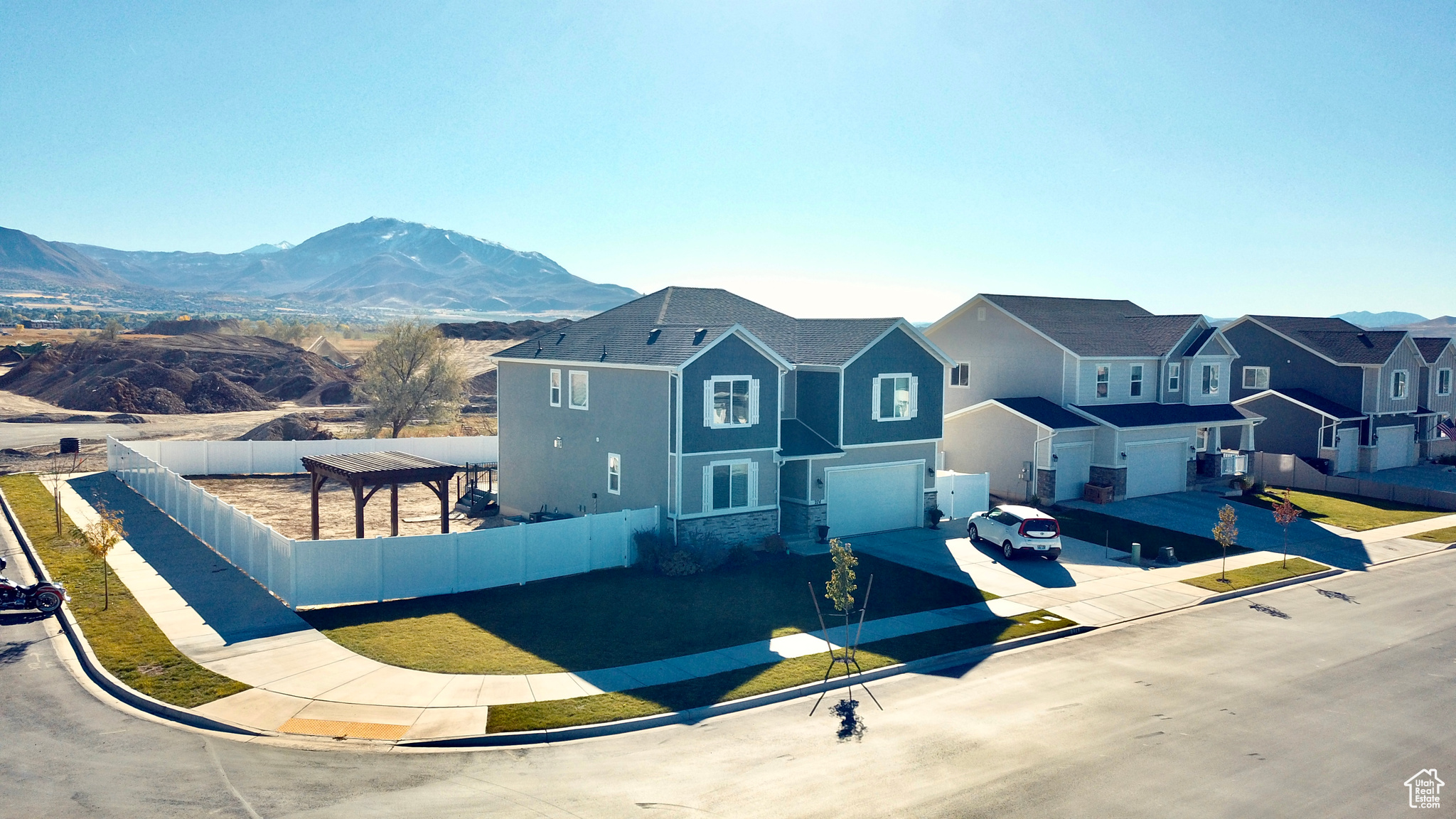 View of front facade featuring a garage and a mountain view