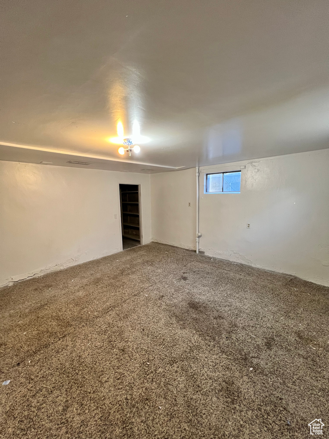 Spare room featuring carpet floors