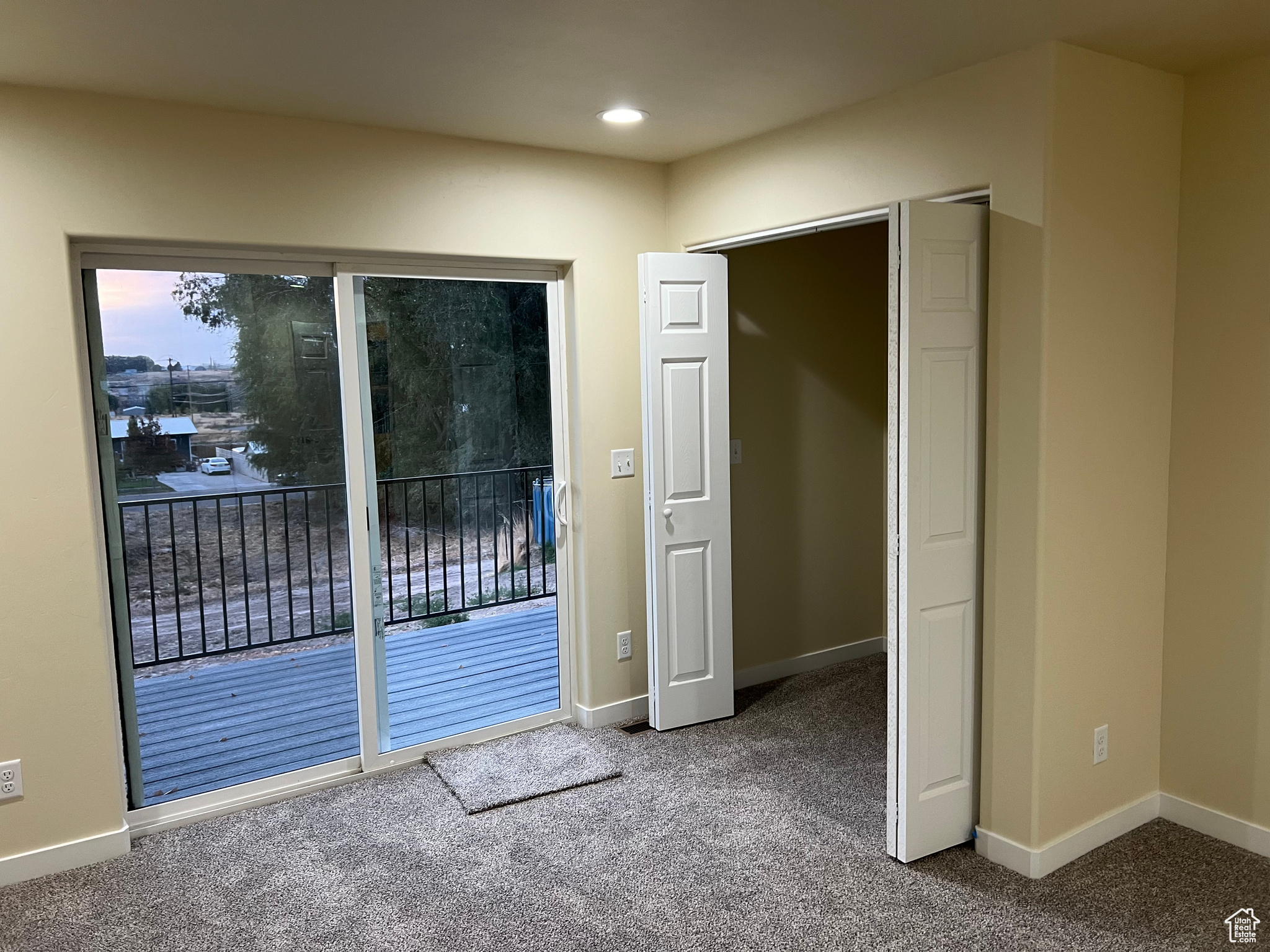 Doorway featuring carpet