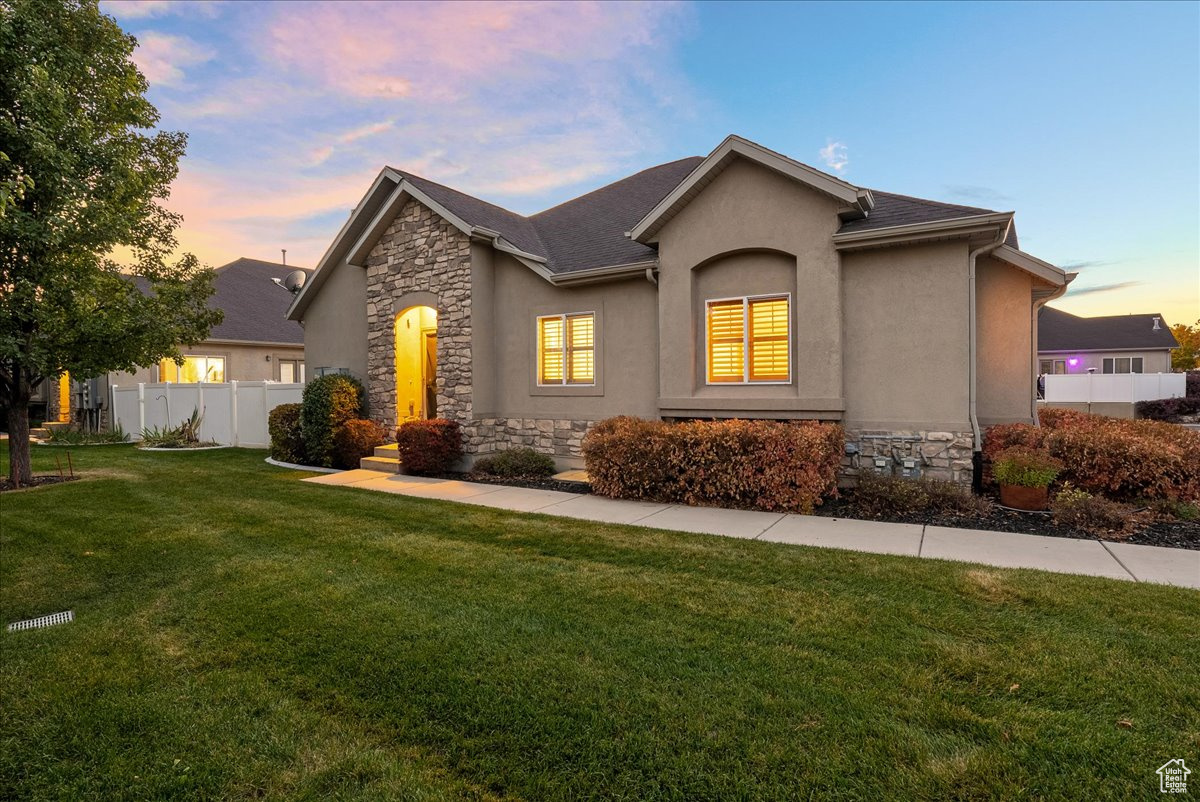 View of front of home featuring a yard