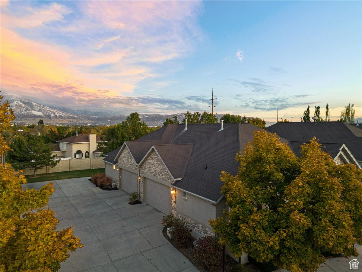 Aerial view at dusk featuring a mountain view