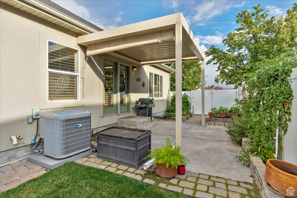 View of patio / terrace with area for grilling and central AC unit