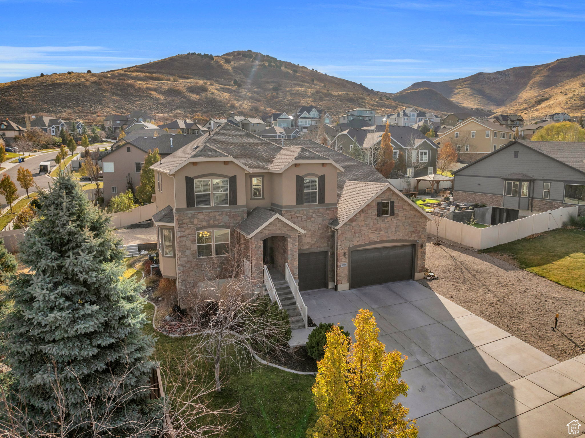 View of front of property featuring a mountain view and a garage