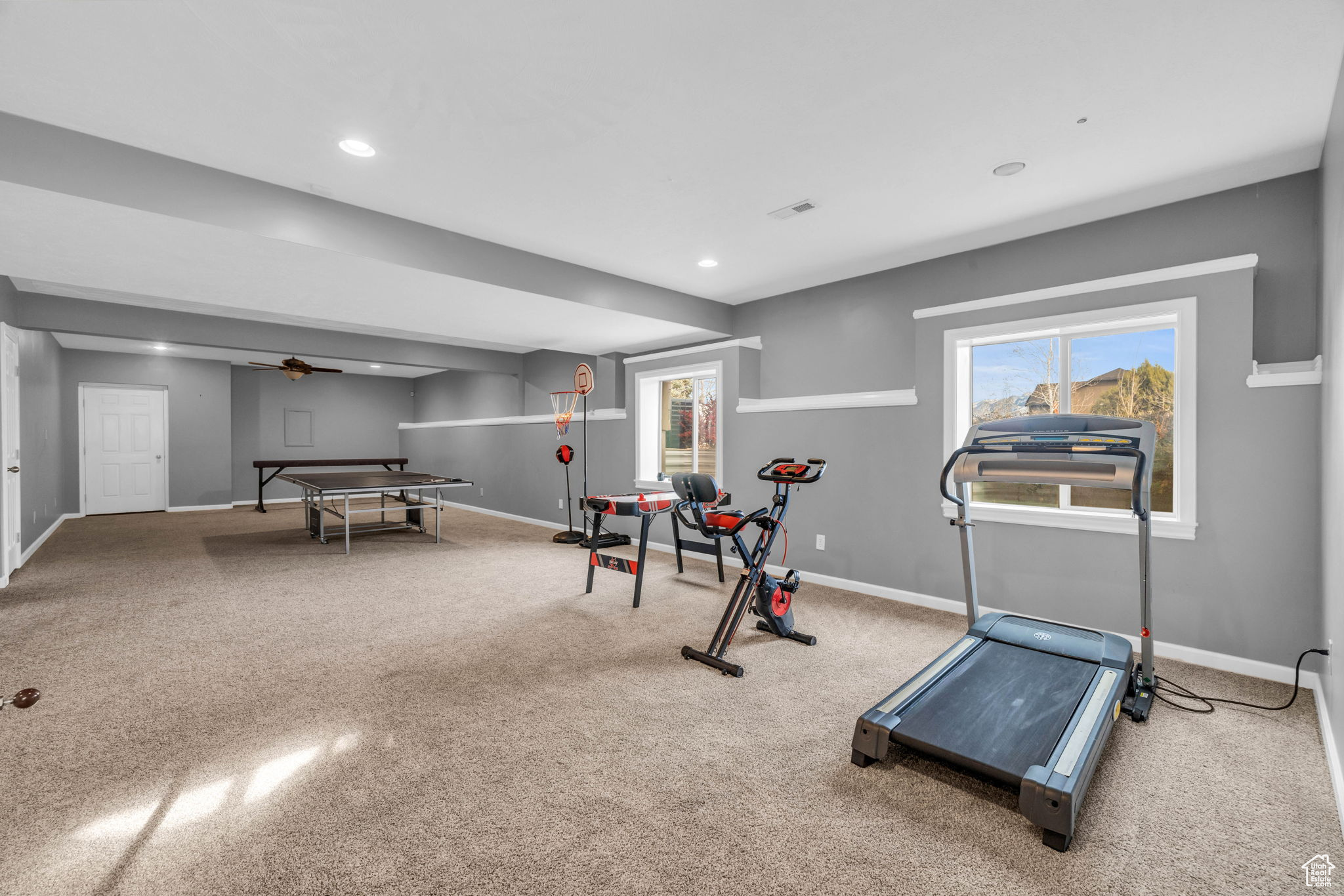 Workout room featuring carpet floors and ceiling fan