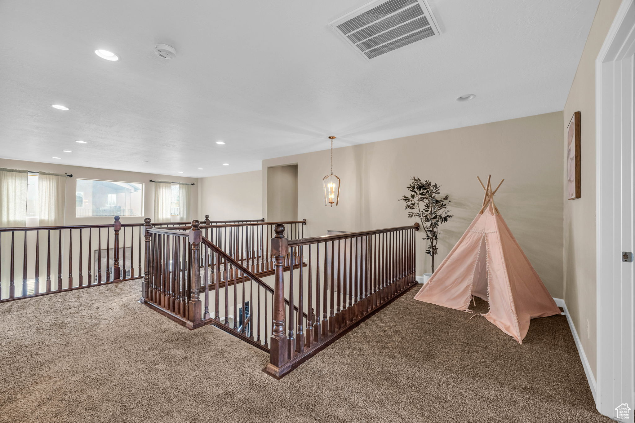 Hallway with carpet flooring