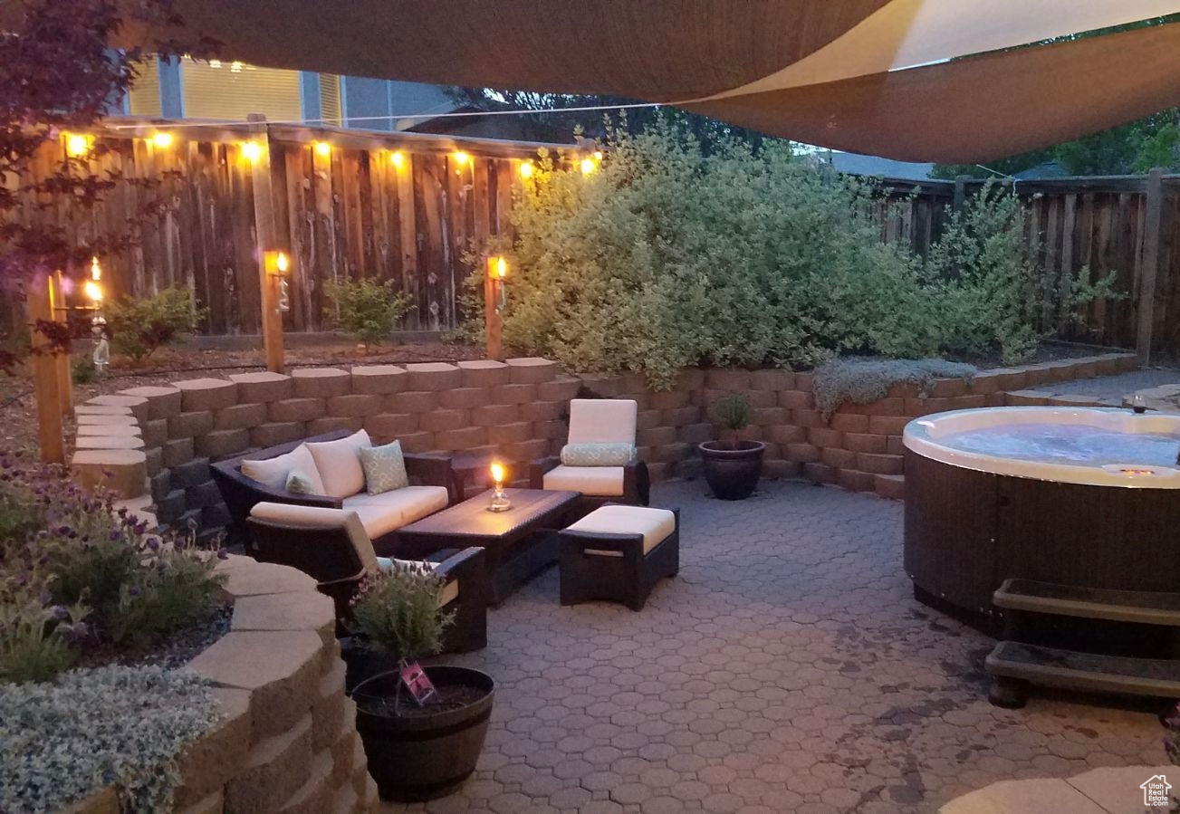 View of patio featuring a hot tub