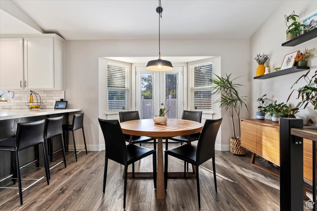 Dining room featuring dark wood-type flooring