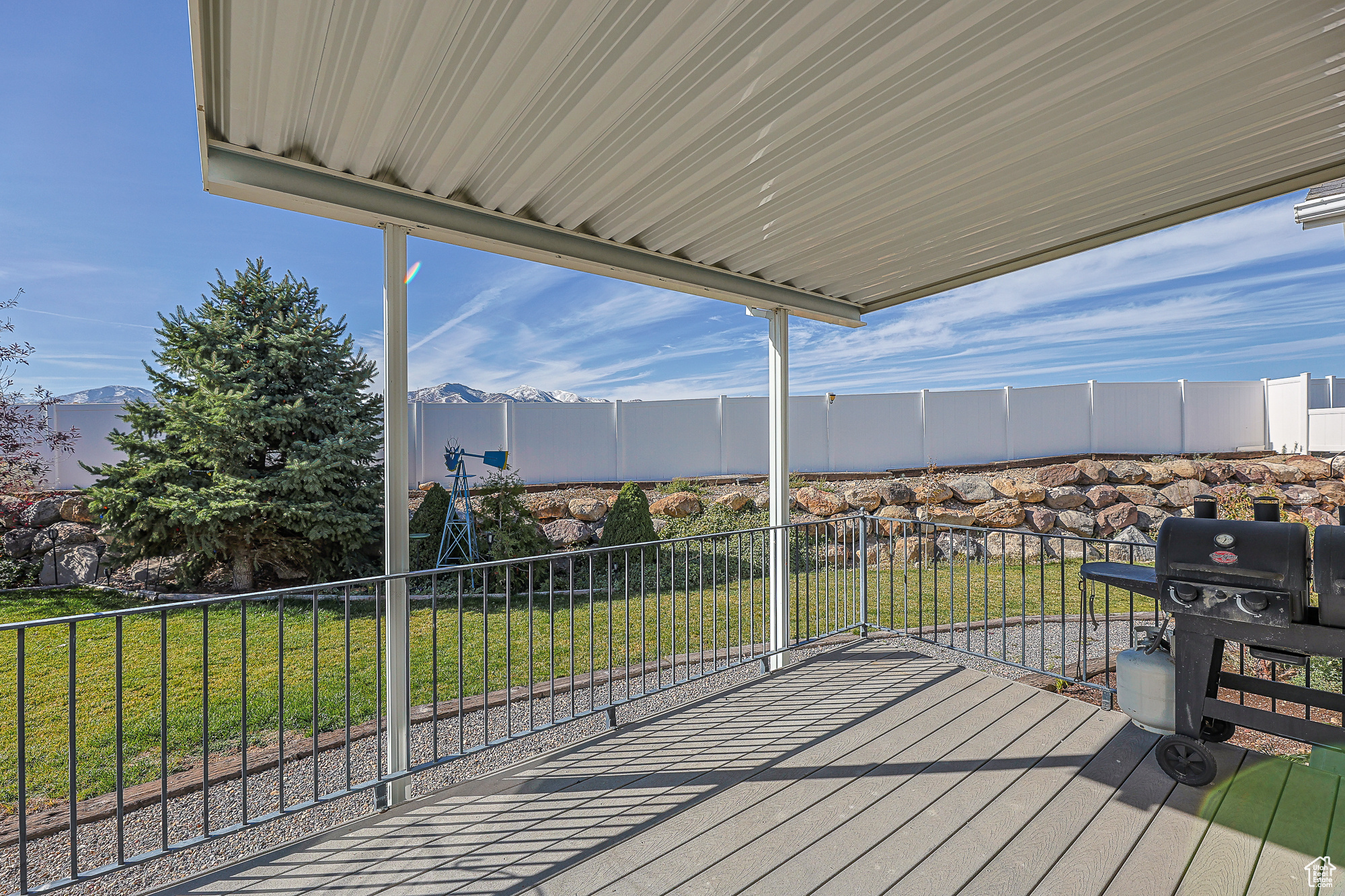 Deck featuring grilling area and a lawn