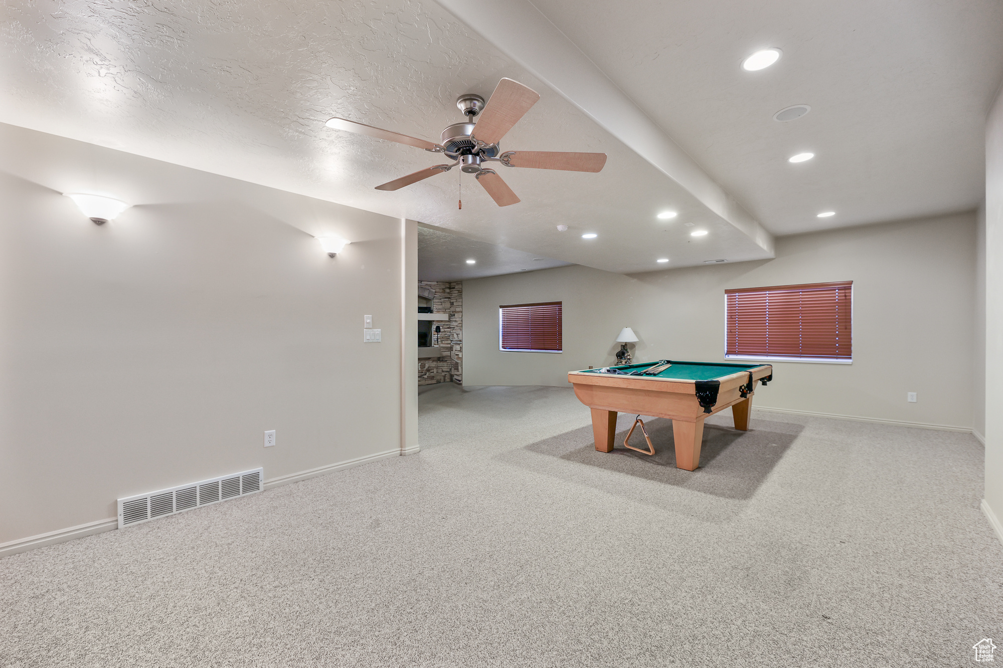 Playroom with pool table, light colored carpet, and ceiling fan