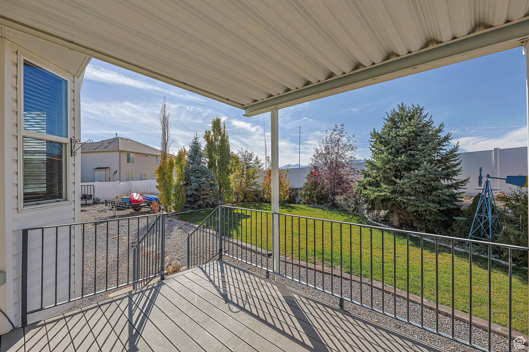 Wooden deck featuring a lawn