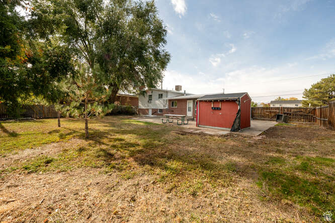 View of backyard with a patio