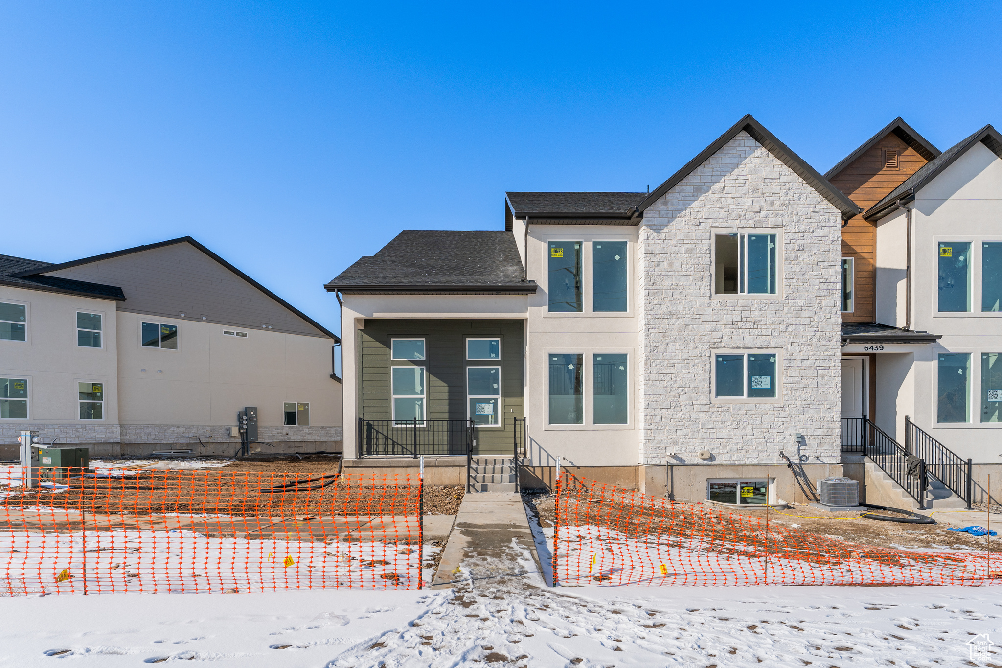 View of front of house with central AC