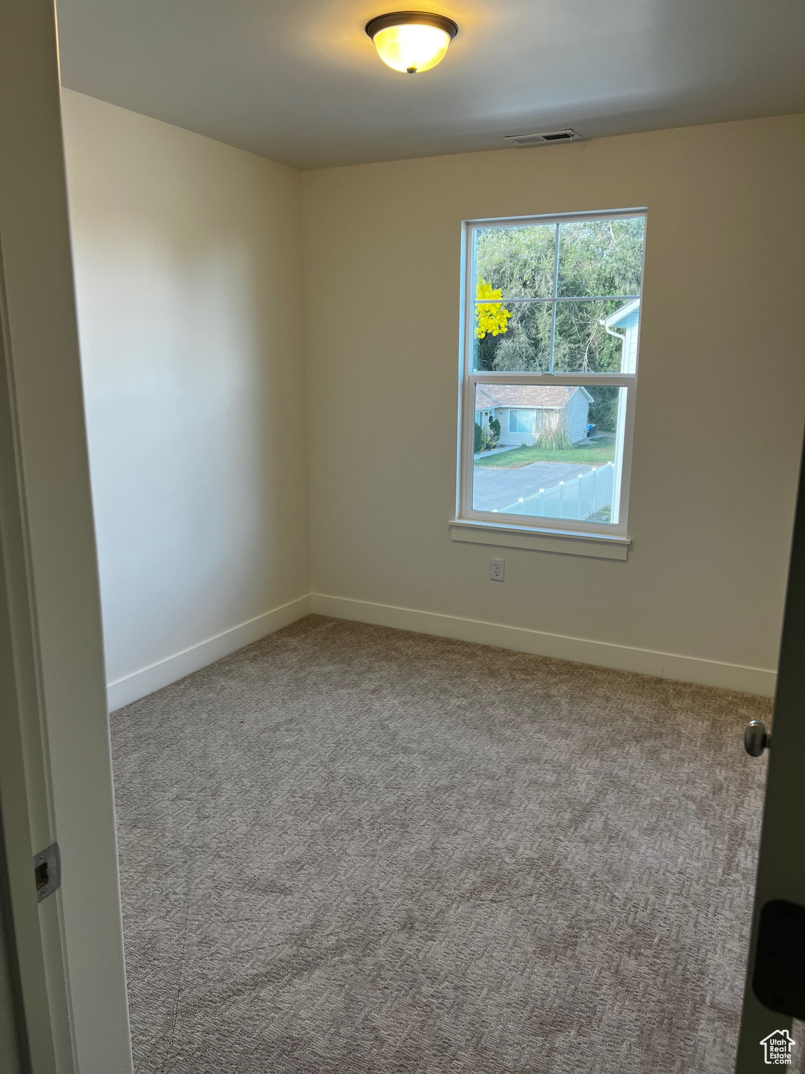 View of carpeted spare room