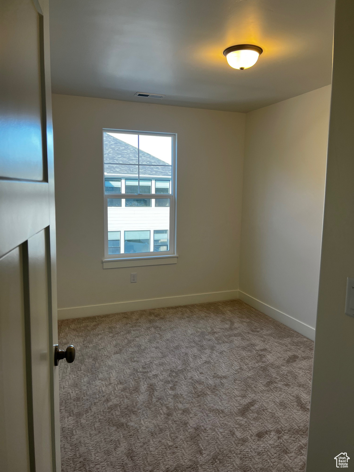 Unfurnished room with carpet floors