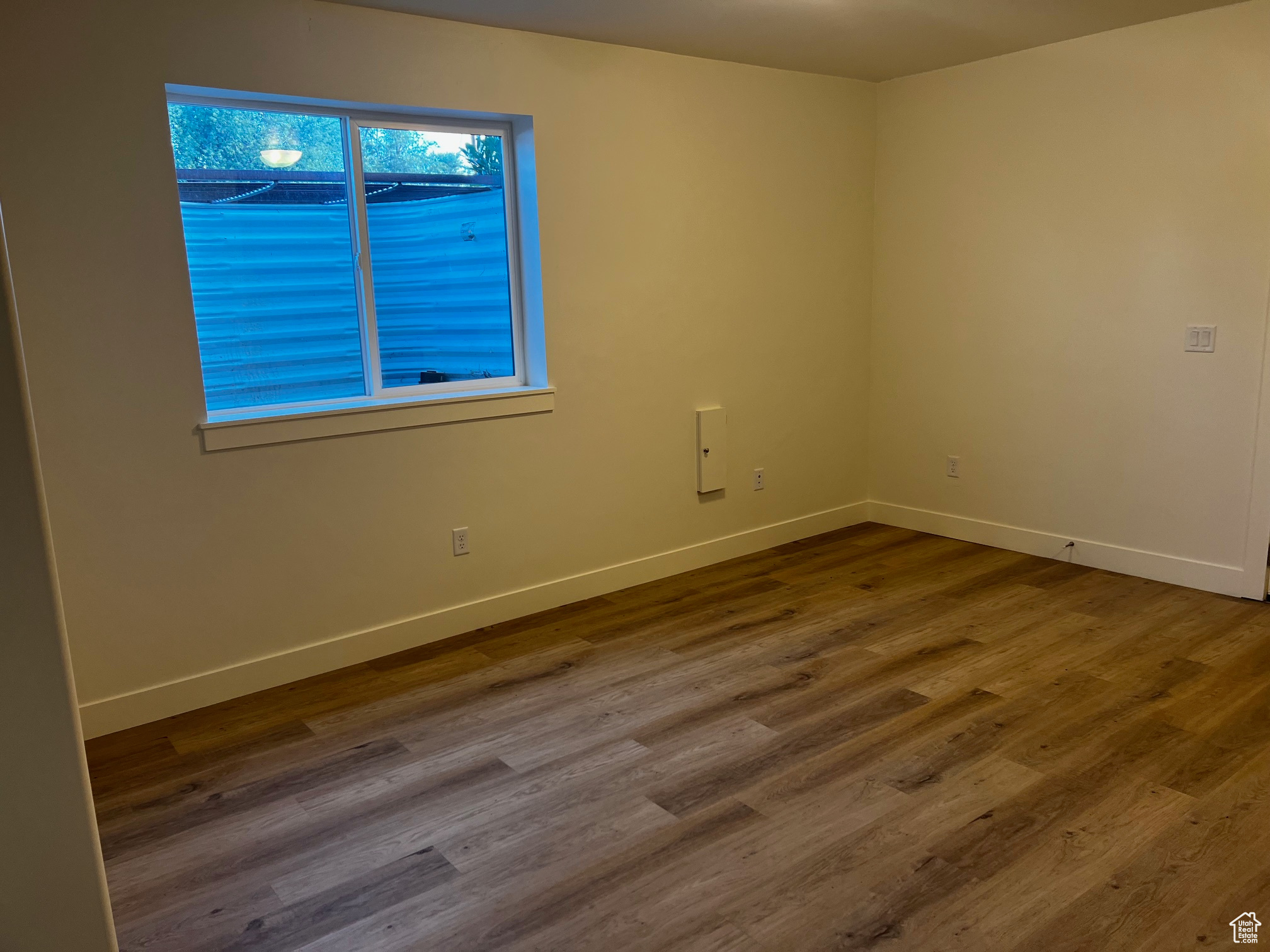 Unfurnished room with hardwood / wood-style floors