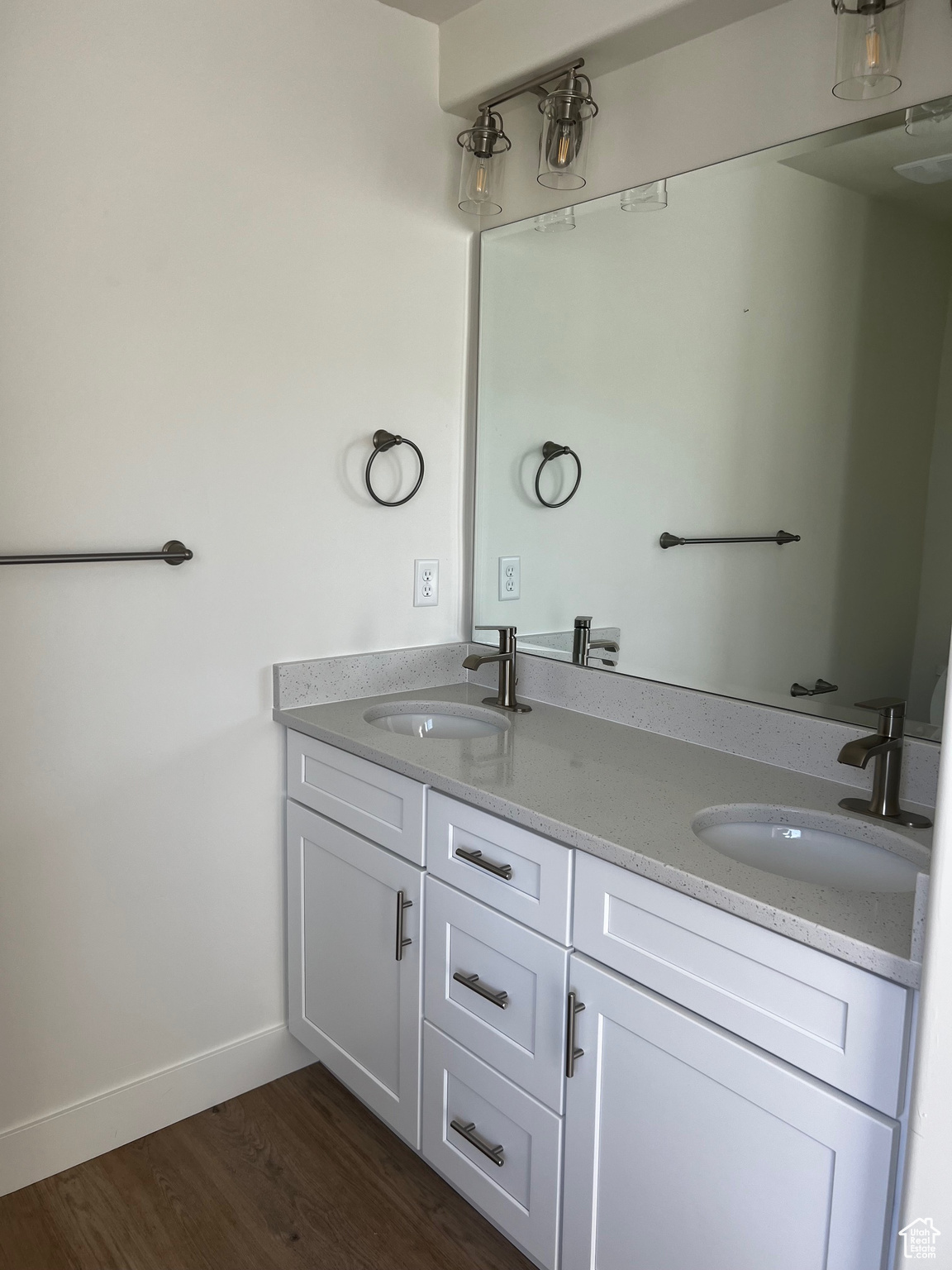 Bathroom with vanity and hardwood / wood-style floors