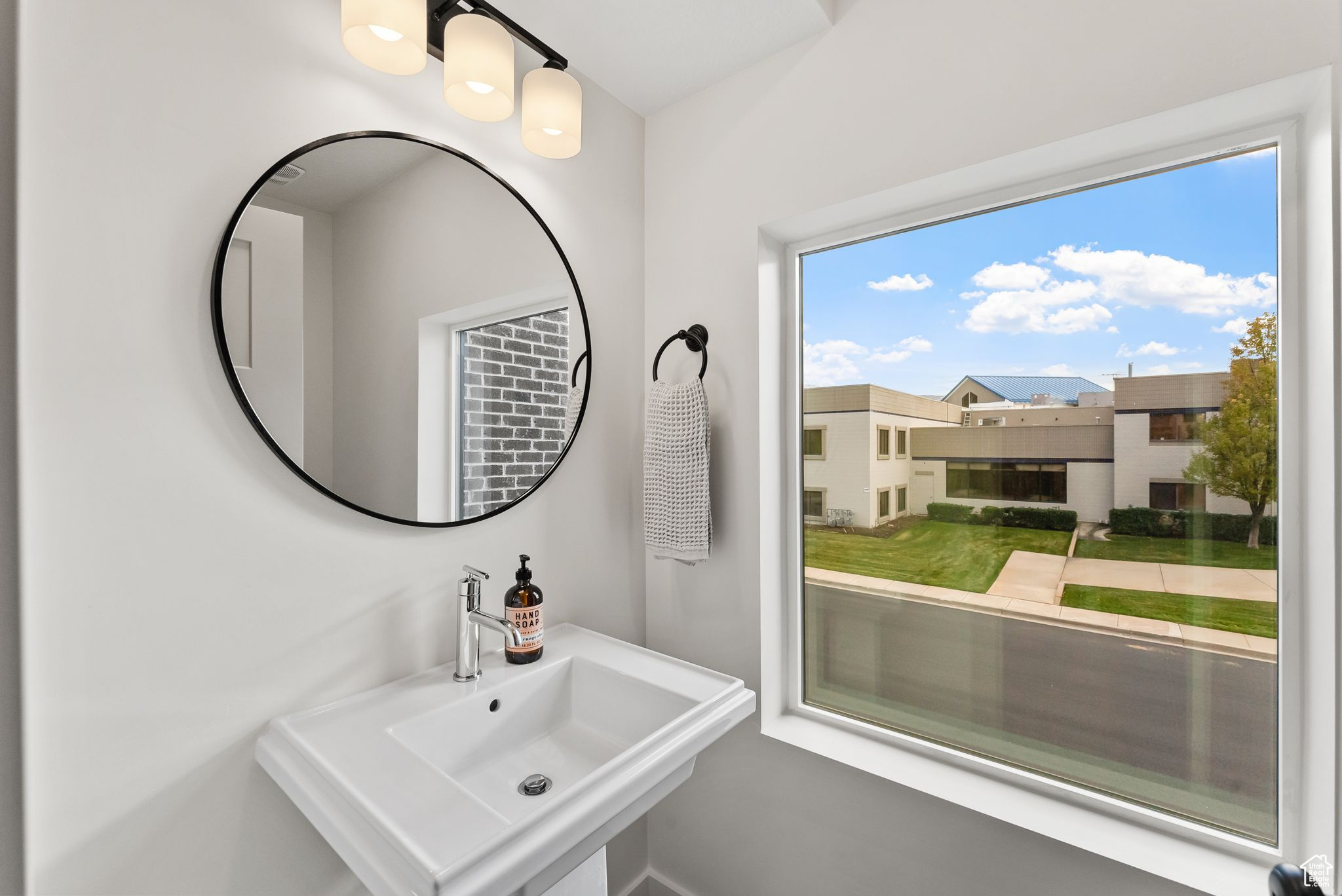 Bathroom featuring a wealth of natural light and sink