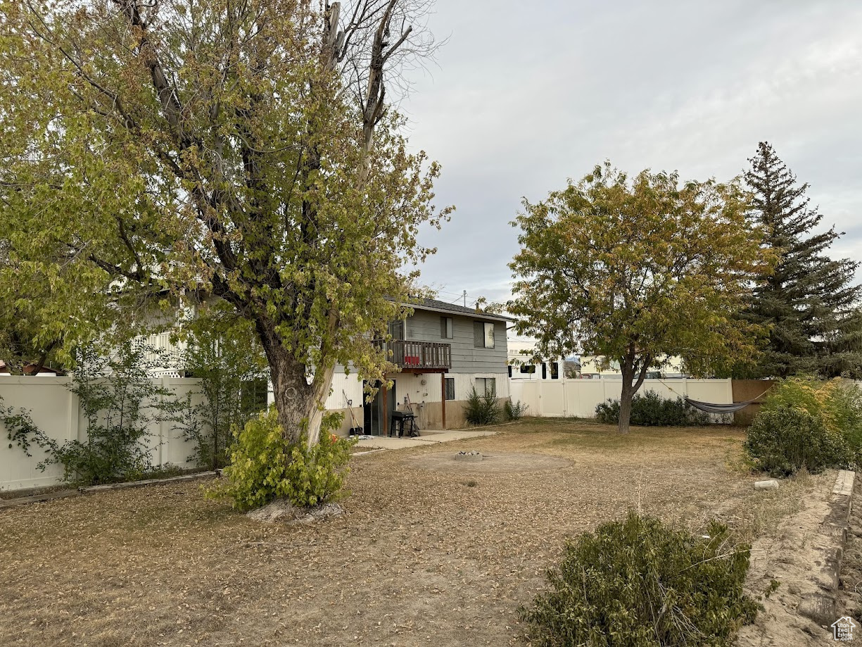 View of yard featuring fence