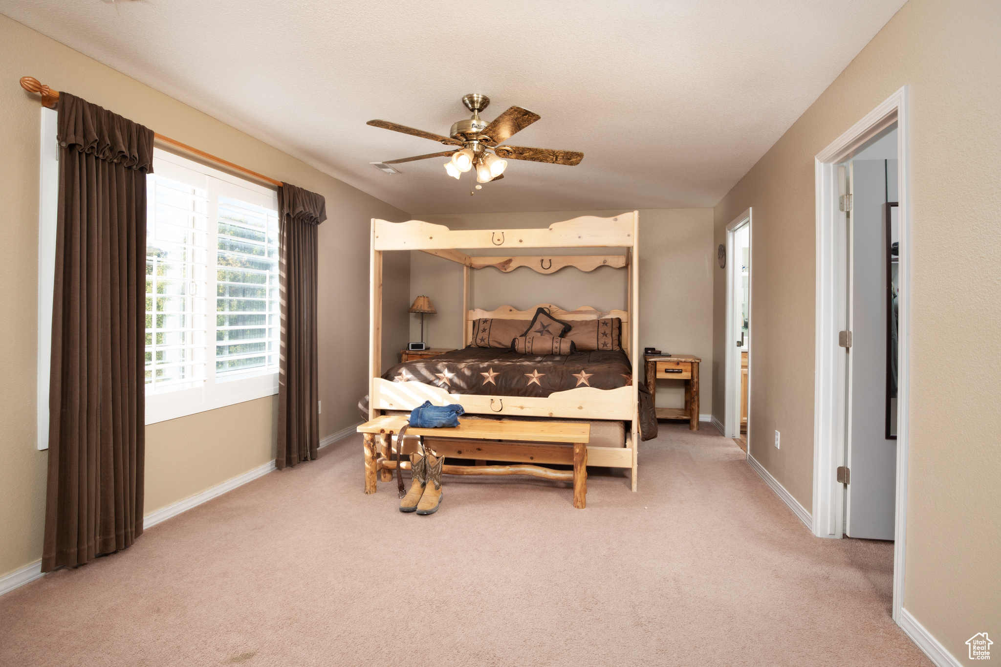 Bedroom featuring carpet floors and ceiling fan