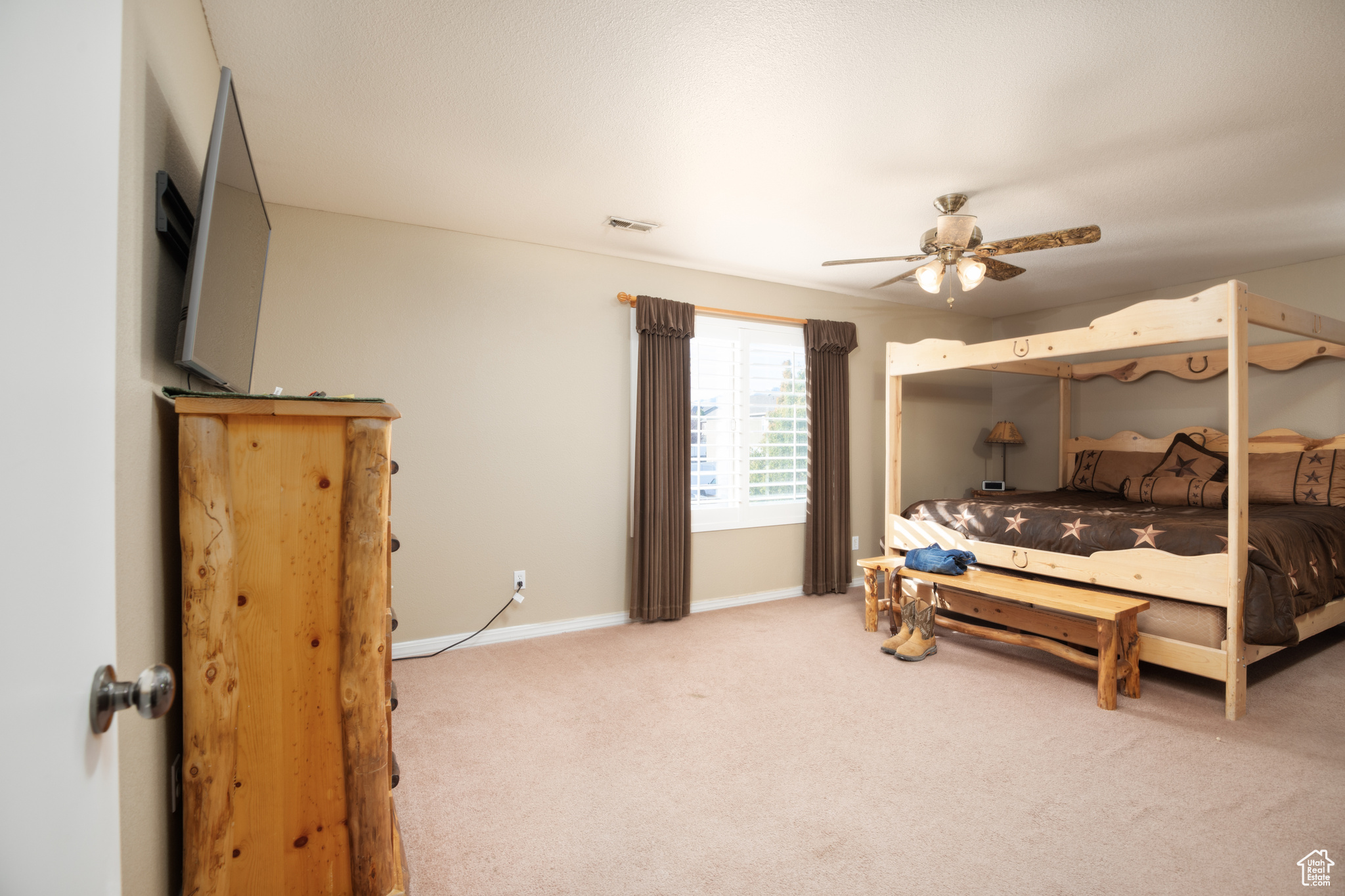 Bedroom featuring carpet and ceiling fan