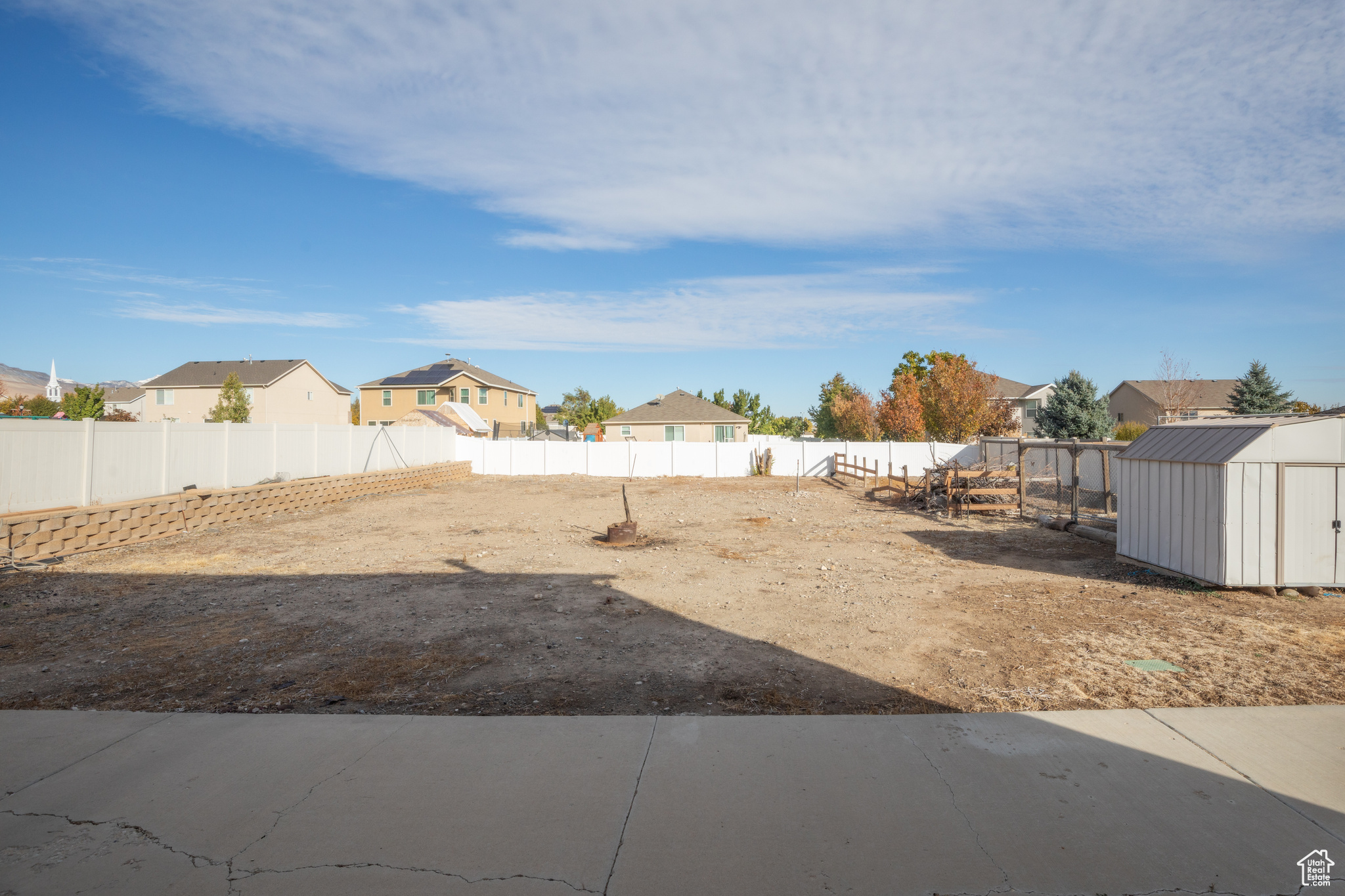 View of yard with a storage unit