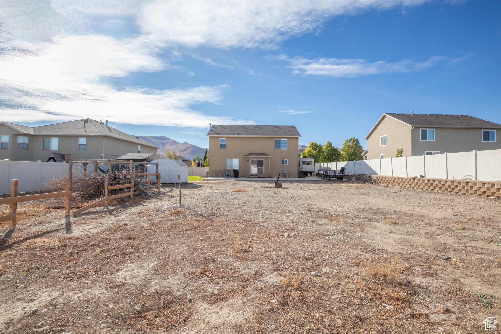 View of yard featuring a storage unit