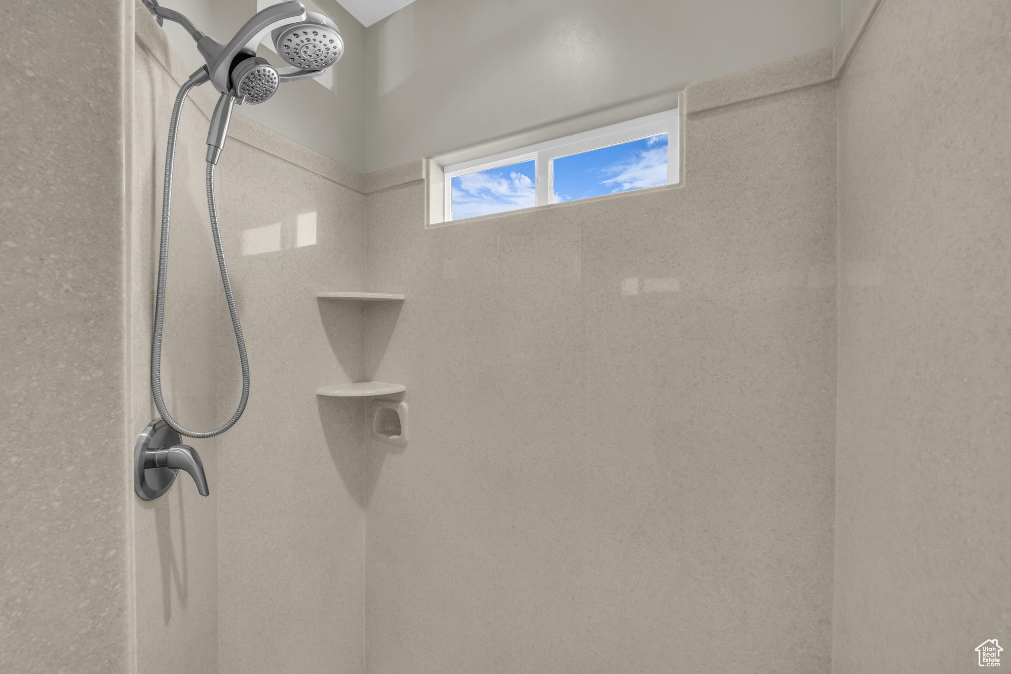 Bathroom featuring a tile shower