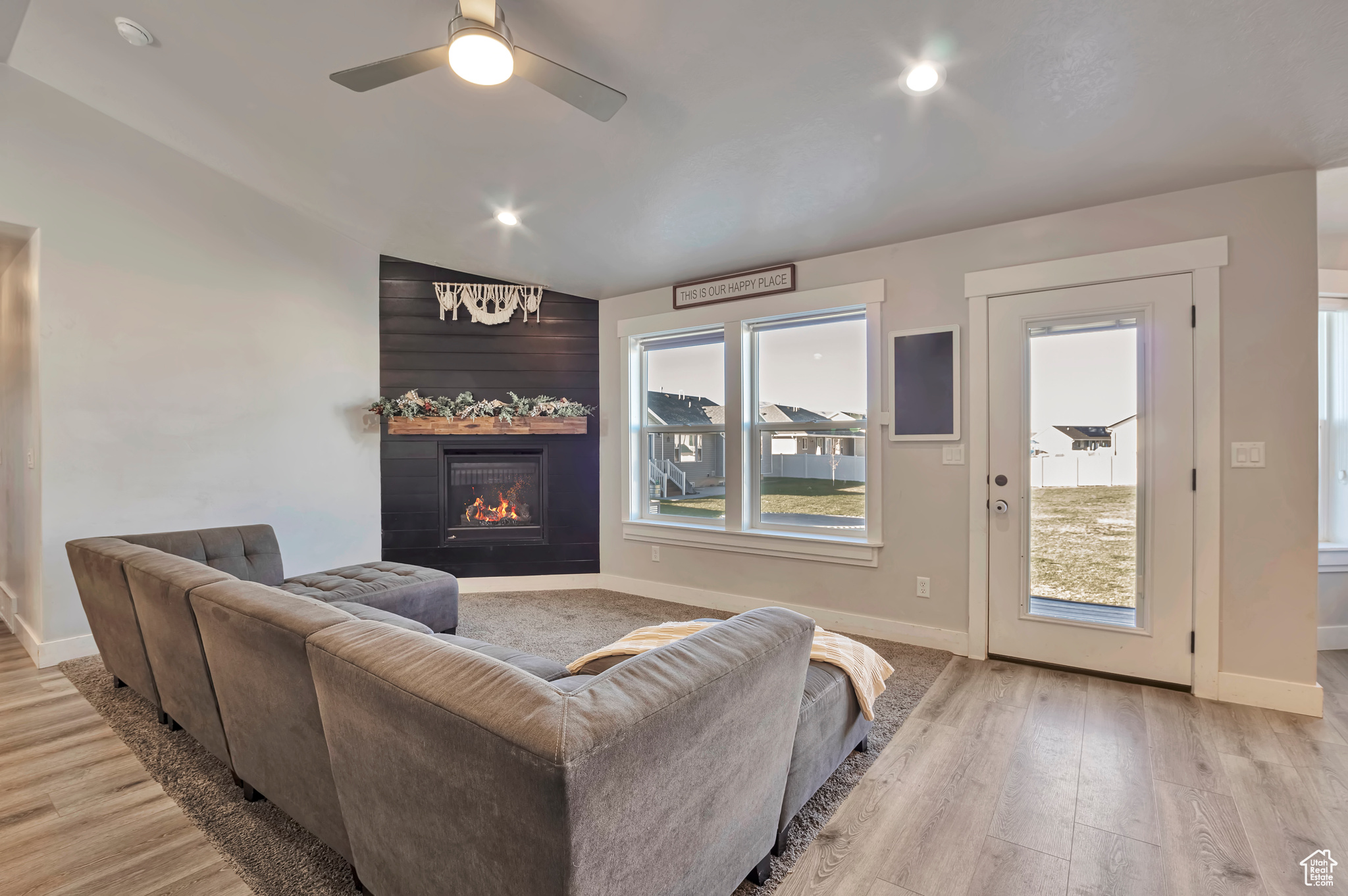 Great Room with LVP flooring and an abundance of natural light.