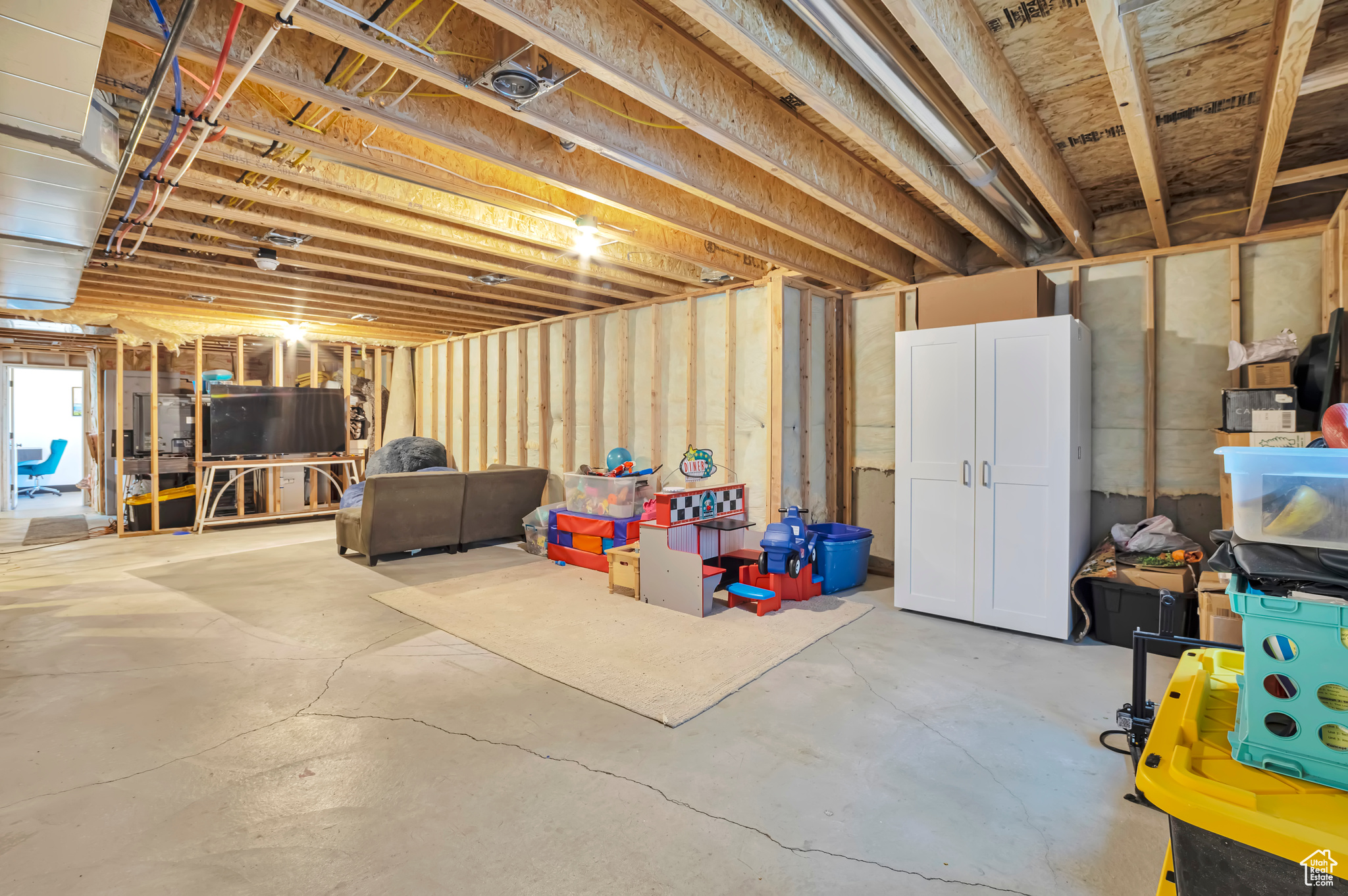 Unfinished basement with 3rd bathroom plumbed.