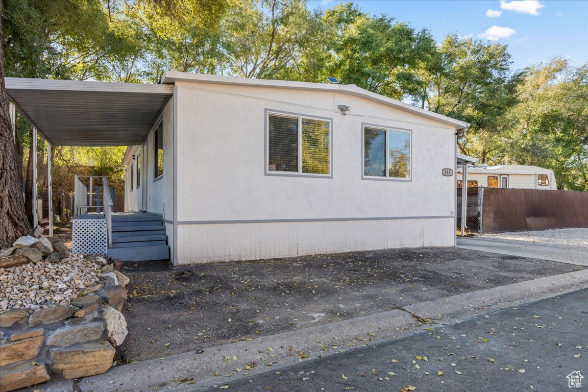 View of front of home with a carport