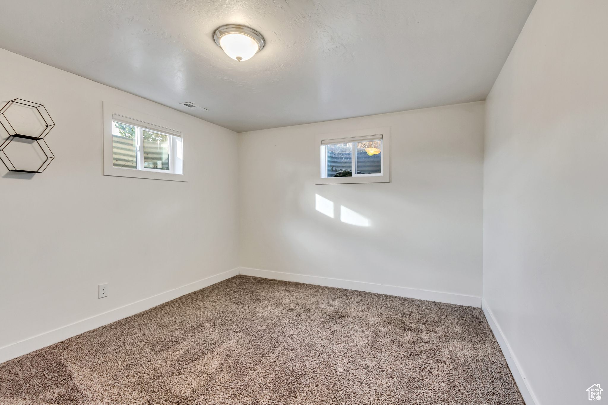 Basement featuring carpet flooring