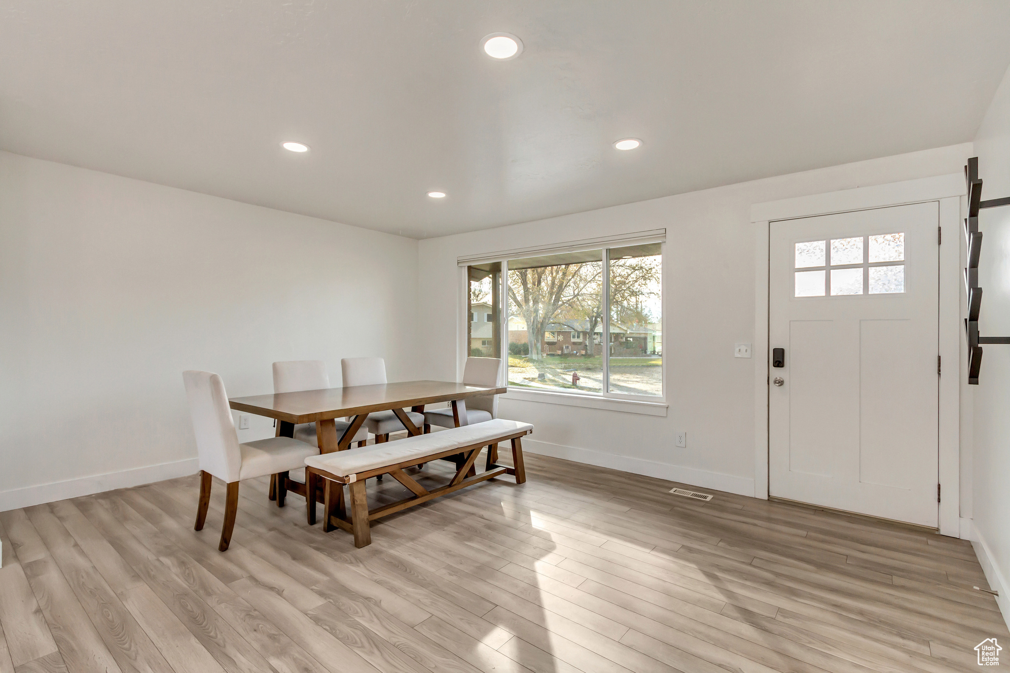 Dining area with light wood-type flooring